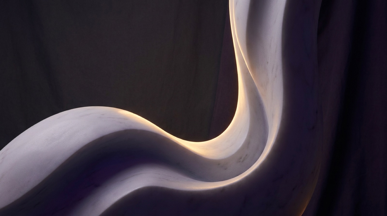 Sculptural marble curves traced by warm gold rim light against deep violet shadow